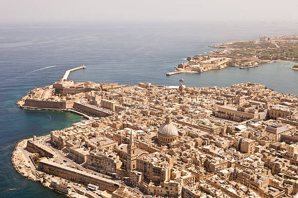 Aerial View of Valletta, Malta. Taken from a light Aircraft Aerial View of the Capital City of Malta. Valletta. The city will be the European Capita of Culture in 2018. One can clearly see the Breakwater and the entrance to the "Grand Harbour", a large natural deep water harbour. Once home to the British Fleet during world war 2. malta photos stock pictures, royalty-free photos & images