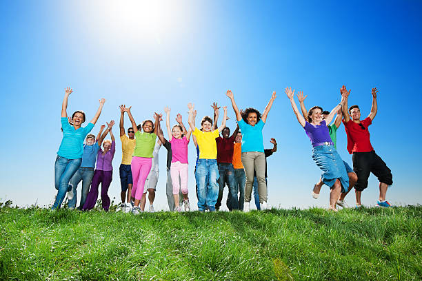 istock Large group of people running against sky. 175394363