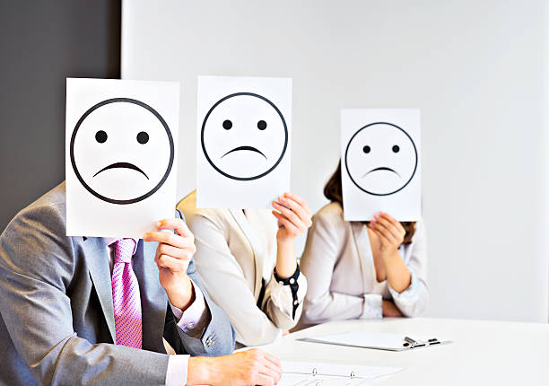 istock Business team holding sad signs 175394677