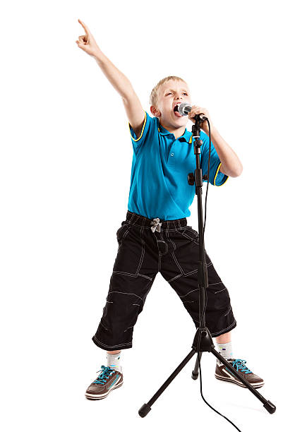 istock Child star or wannabe pop singer singing enthusiastically into mic 175394941