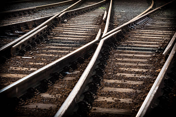 linea ferroviaria crossing - railroad track direction choice transportation foto e immagini stock