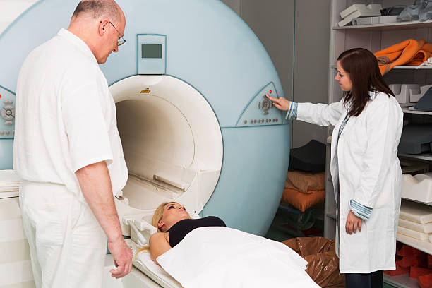 istock Chief Radiologist,young doctor and  patient having MRI scan 175395874