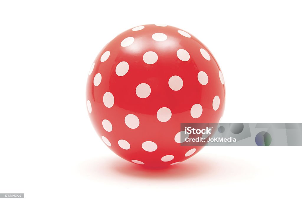 Dotted Red Ball Red ball with white dots isolated on a white background. Sports Ball Stock Photo