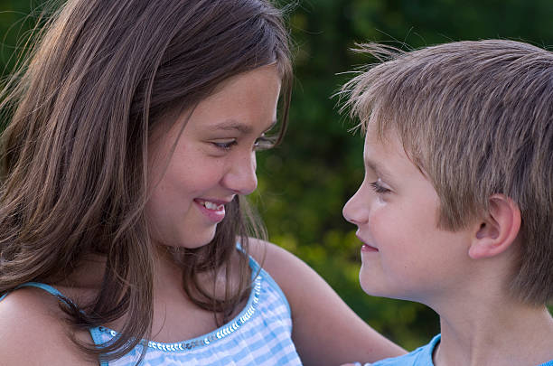 istock brother and sister smile 175396660