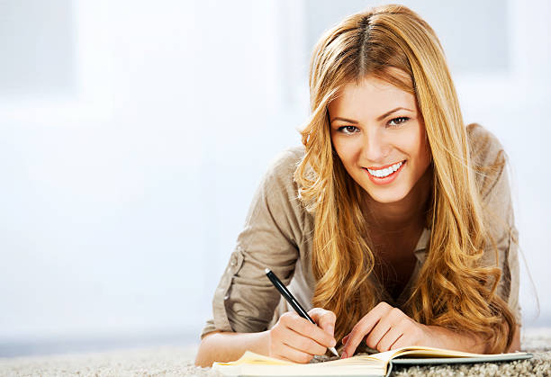 istock Portrait of a blonde woman writing diary 175396696