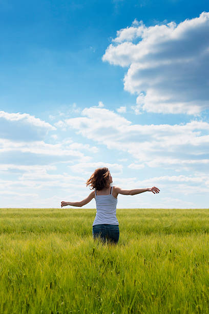 istock Girl in a green field 175396797