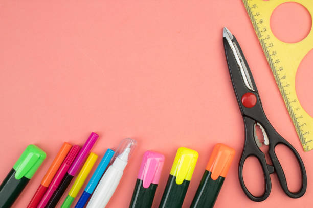 istock Back to school. Stationery on a salmon color table. Office desk with copy space. Flat lay. 1753969861