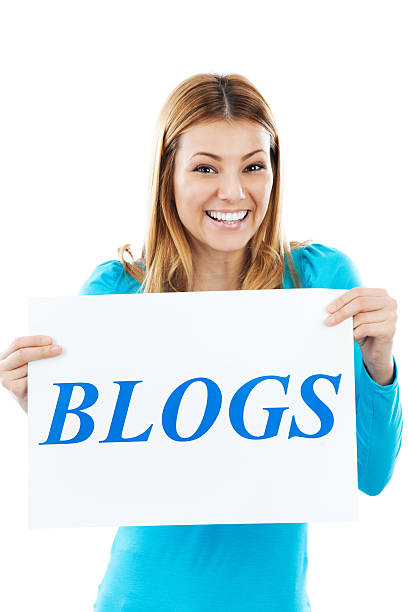 istock Cheerful young girl holding BLOGS sign. 175397144
