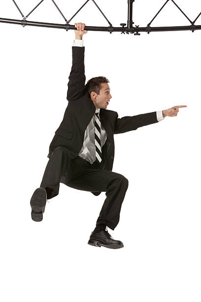 istock Businessman hanging from a metal structure 175397176