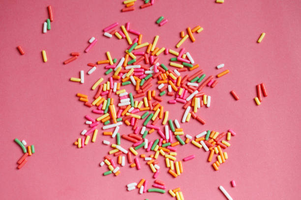 istock Toppings for donuts, desserts and ice cream on pink background. 1753976729