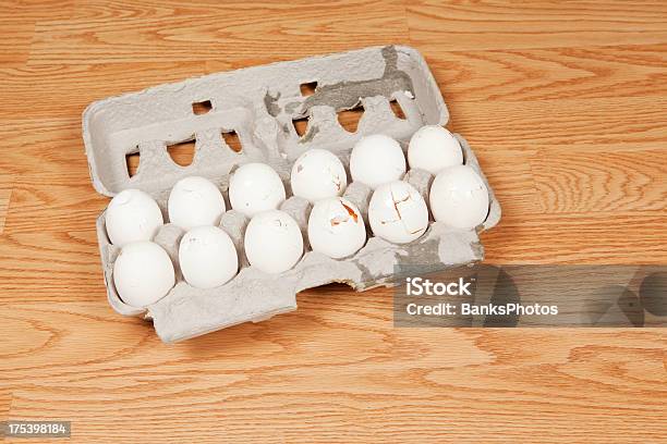 One Dozen Broken Eggs In Carton On Floor Stock Photo - Download Image Now - Animal Egg, Broken, Egg - Food