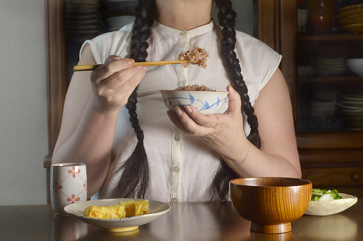 Woman Having Healthy Food in Dinning Room/Studio Shot