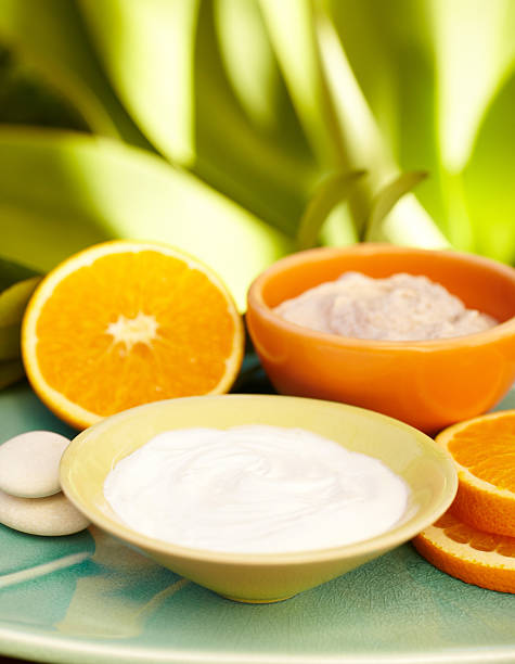 istock Spa exfoliation salt scrub, moisturizer orange slices on a plate 175398223