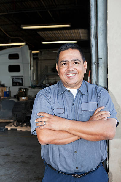 istock Mechanic standing outside garage 175398275