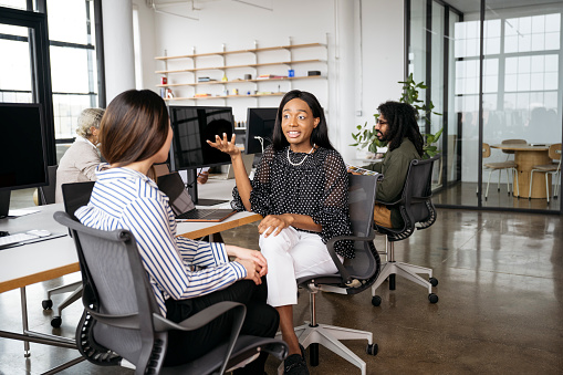 Open Working Environment Creative Associates Enjoying Open Plan Work Environment Stock Photo ...