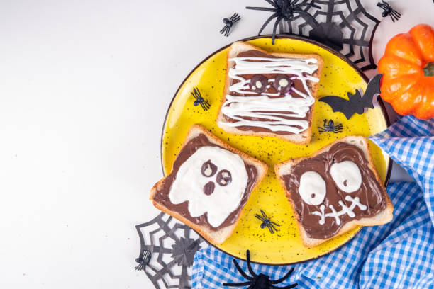 istock Funny Halloween characters toasts with nuts butter 1753989578