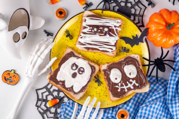istock Funny Halloween characters toasts with nuts butter 1753989596