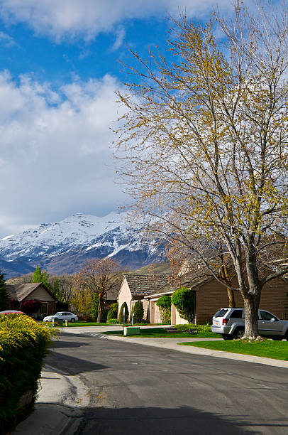 Provo, Utah contemporary homes, Wasatach Mountain Range, Western USA "This scene is in a Provo, Utah residential community at the base of the Wasatch Mountain Range, Utah County, Western USA. The homes are late 20th century built contemporary style and enjoy a sweeping view of the Utah Valley." provo stock pictures, royalty-free photos & images