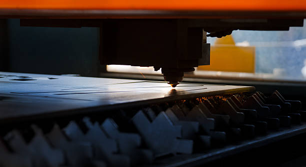istock Numerical control machine: laser beam cutting metal sheet, detail 175399013