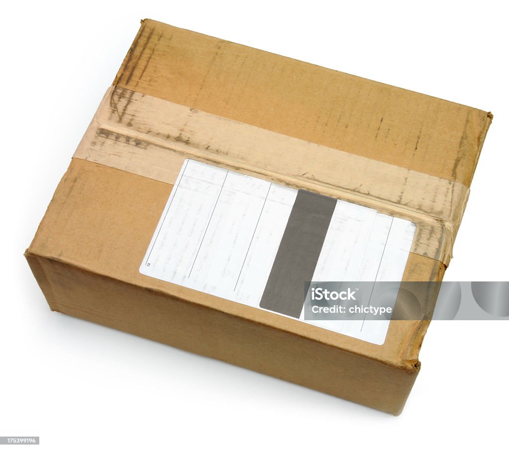 Parcel Parcel with a blank label to insert our own message.  Adhesive Tape Stock Photo