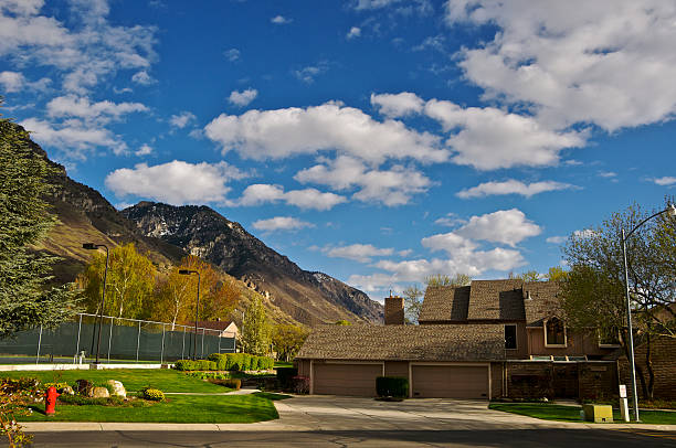 Utah Valley Contemporary Home "This scene is in a Provo, Utah residential community at the base of the Wasatch Mountain Range, Utah County, Western USA. The homes are late 20th century built contemporary style and enjoy a sweeping view of the Utah Valley." provo stock pictures, royalty-free photos & images