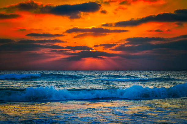 Serene Sunset: Tranquil Horizon over Ocean with Dramatic Sky and Afterglow on the most beautiful beach.