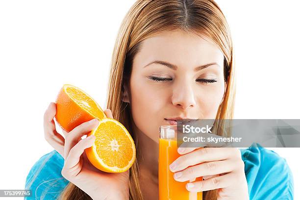 Young Woman Drinking Orange Juice Stock Photo - Download Image Now - Adult, Adults Only, Beautiful People