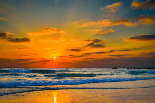 Serene Sunset: Tranquil Horizon over Ocean with Dramatic Sky and Afterglow on the most beautiful beach.