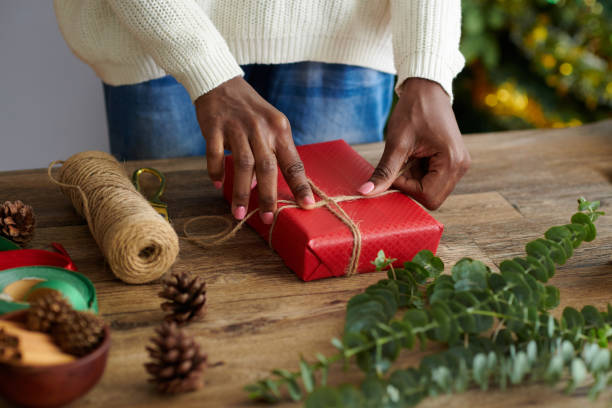 istock Woman Tying Present with Twine 1754004157