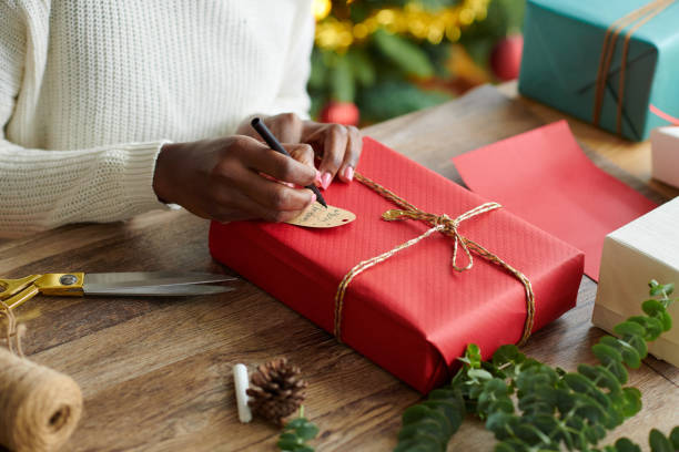 istock Woman Signing Christmas Presents 1754004168