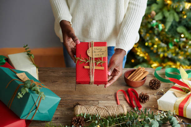 istock Woman Showing Christmas Present 1754004432
