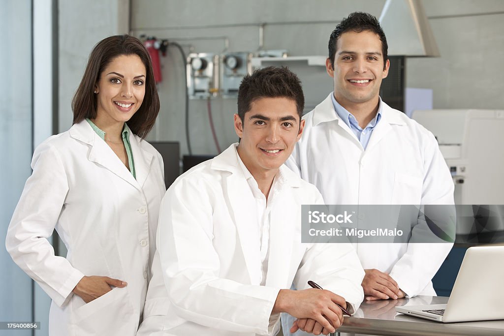 Scientist Team Working at Laboratory "Scientist Team Working at Laboratory, Meeting,Agree,Optimist,Computer,Lab Equipment" Adult Stock Photo