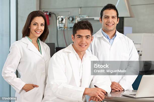 Scientist Team Working At Laboratory Stock Photo - Download Image Now - Adult, Agreement, Analyzing