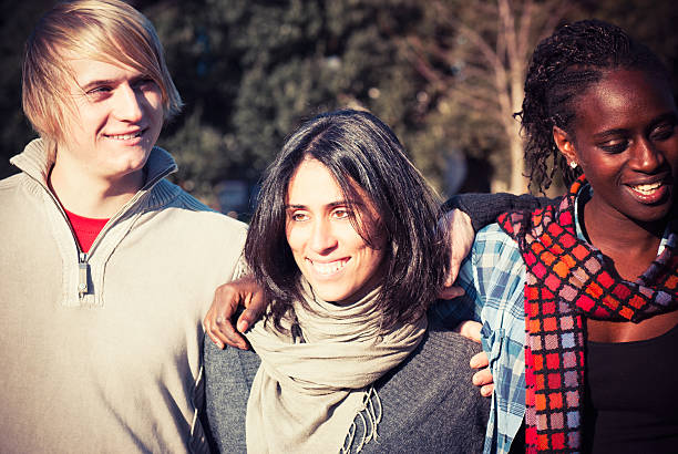 istock Multiracial Friends embraced enjoy at dusk sunlight 175401143
