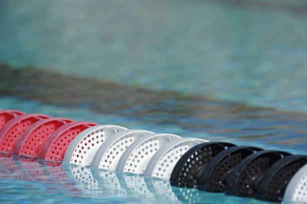 sport swimming pool 13 sport swimming pool of 25 meters with lanes and blue water - ready for competition swimming pool lane ropes stock pictures, royalty-free photos & images