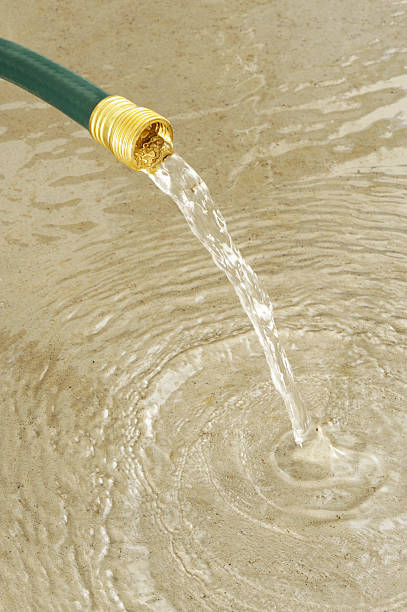 istock Gardening hose and water 175401443