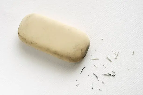 Eraser with residue on a white sheet of paper.