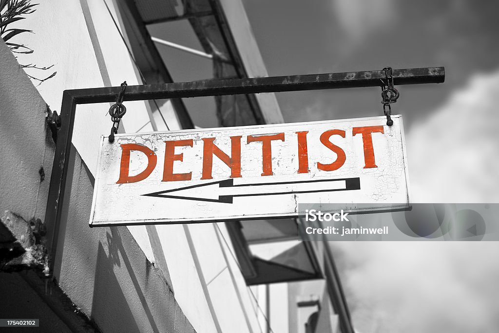 red dentist sign with arrow Antique Stock Photo