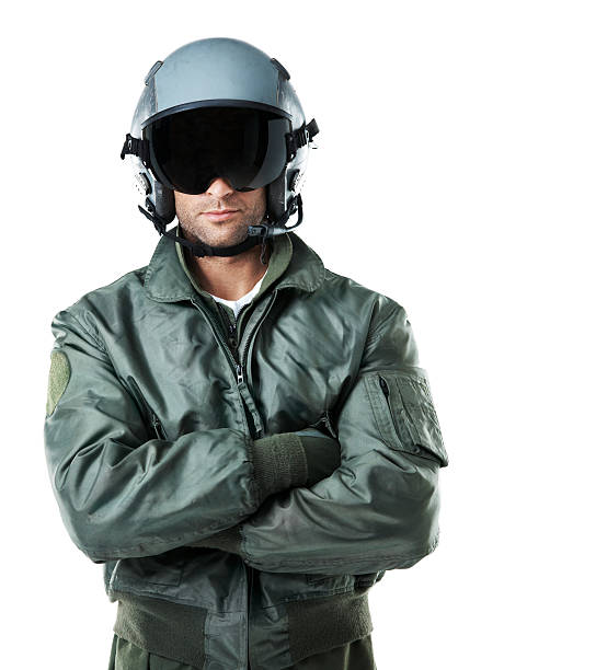 Visor down ... all set for flight! Confident male air-force pilot wearing a helmet and crossing his arms while isolated on white background - Copyspace air force stock pictures, royalty-free photos & images
