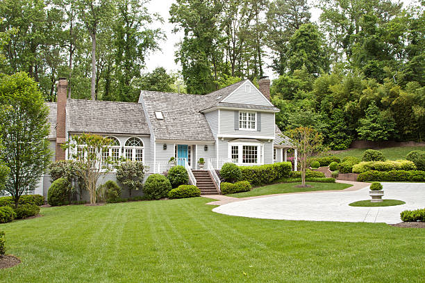 A lovely thatched back roof large suburban house stock photo