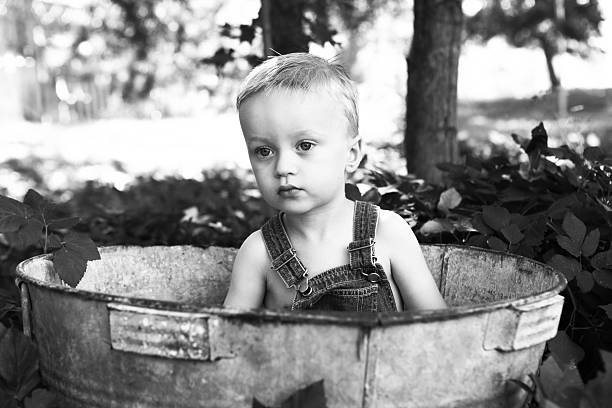 istock Little Boy Outside in Antique Bucket 175403053