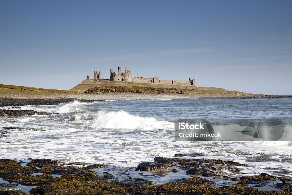 Dunstanburgh castle Northumberland England Beach Stock Photo