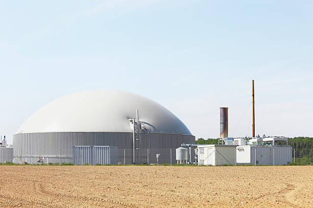 istock fresh planted field and bio gas power plant generator chimney 175403822