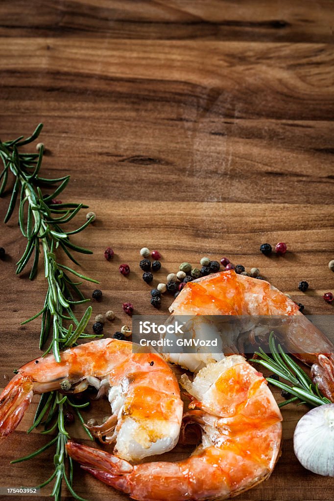 Shrimp Background Herbs and shrimps on a wooden background Backgrounds Stock Photo