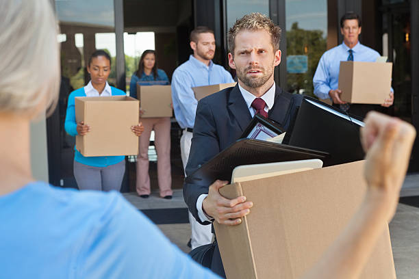 istock Business professionals being fired or laid off leaving office 175404230