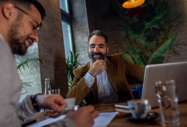 istock Two businessman having a business meeting in cafe. 1754043621
