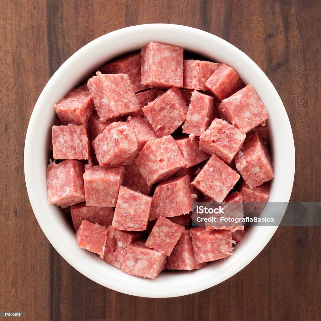 Diced salami Top view of white bowl full of diced salami Cube Shape Stock Photo