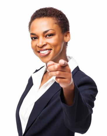 Portrait of smiling African American businesswoman pointing at you. Horizontal shot. Isolated on white.