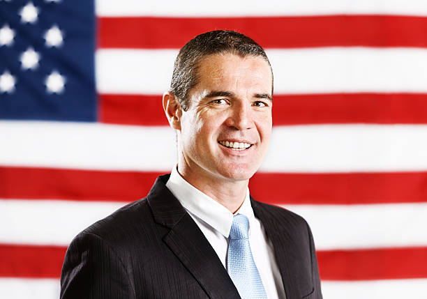 istock Smiling confident-looking man in front of Stars and Stripes 175406987