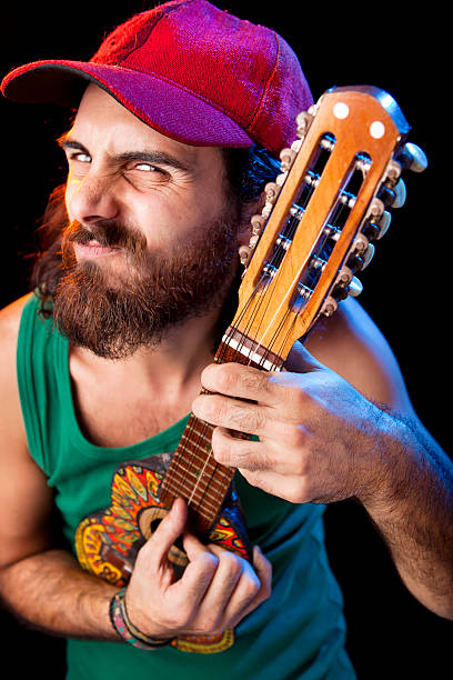 istock Musician playing small guitar at concert 175407262